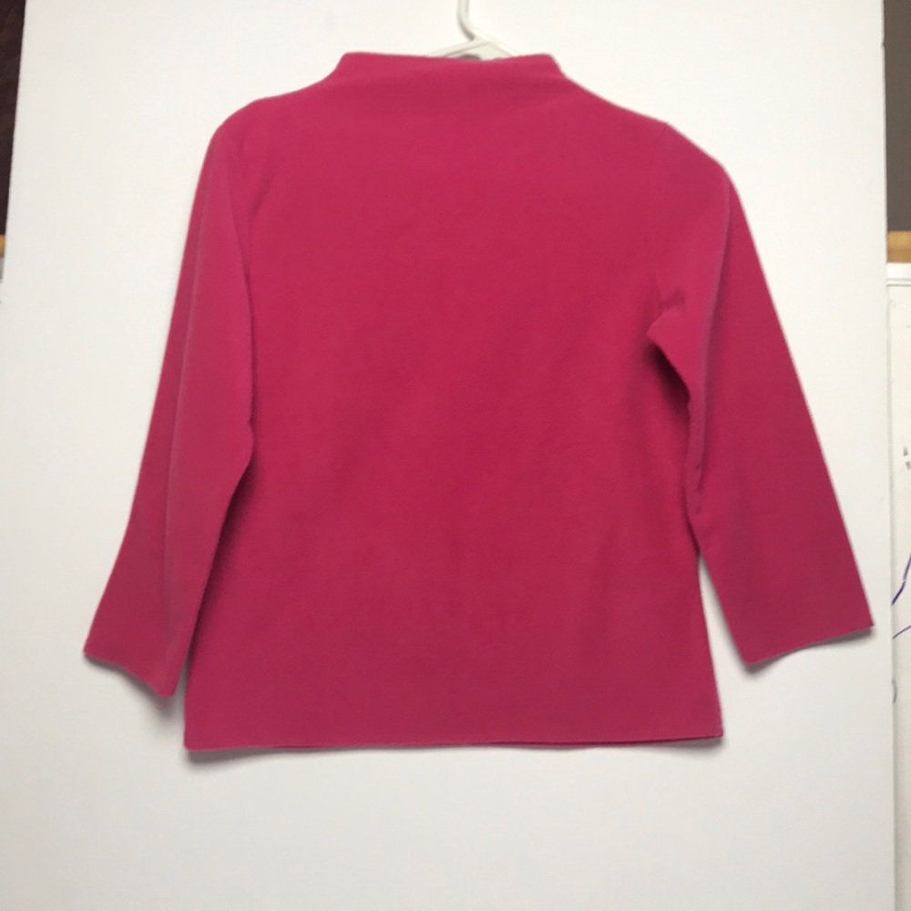 Pink sweater.
